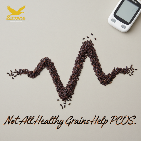 Black rice grains arranged in wave pattern with blurred glucometer symbolizing low glycemic grain choice for PCOS diet